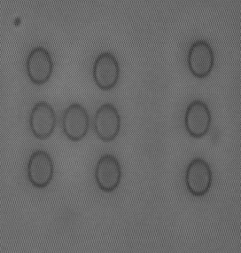 2 micron polystyrene spheres arranged to form the word `hi' using optical tweezers (Physics)